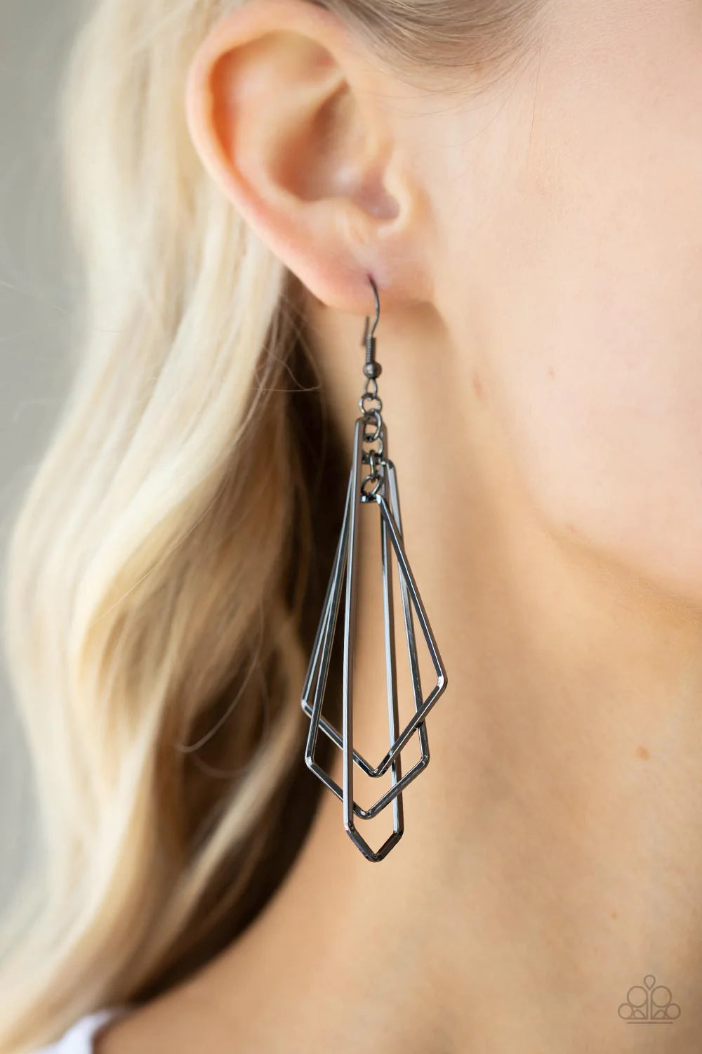 Paparazzi Accessories Shape Shifting Shimmer - Black A mismatched collection of flared geometric gunmetal frames link into a layered lure, creating an edgy metallic tassel. Earring attaches to a standard fishhook fitting. Sold as one pair of earrings. Jew