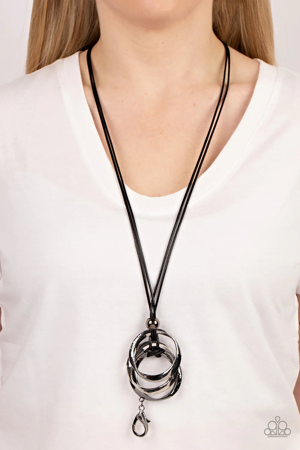 Paparazzi Accessories Harmonious Hardware - Black *Lanyard Infused with a glistening gunmetal bead, curved silver and gunmetal rings are knotted in place at the bottom of a shiny black cord for an intense industrial display. A lobster clasp hangs from the