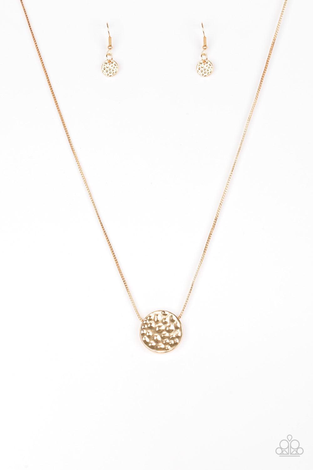 Paparazzi Accessories The BOLD Standard - Gold Delicately hammered in shimmery detail, a glistening gold pendant slides along a dainty gold box-chain below the collar for a bold look. Features an adjustable clasp closure. Sold as one individual necklace.