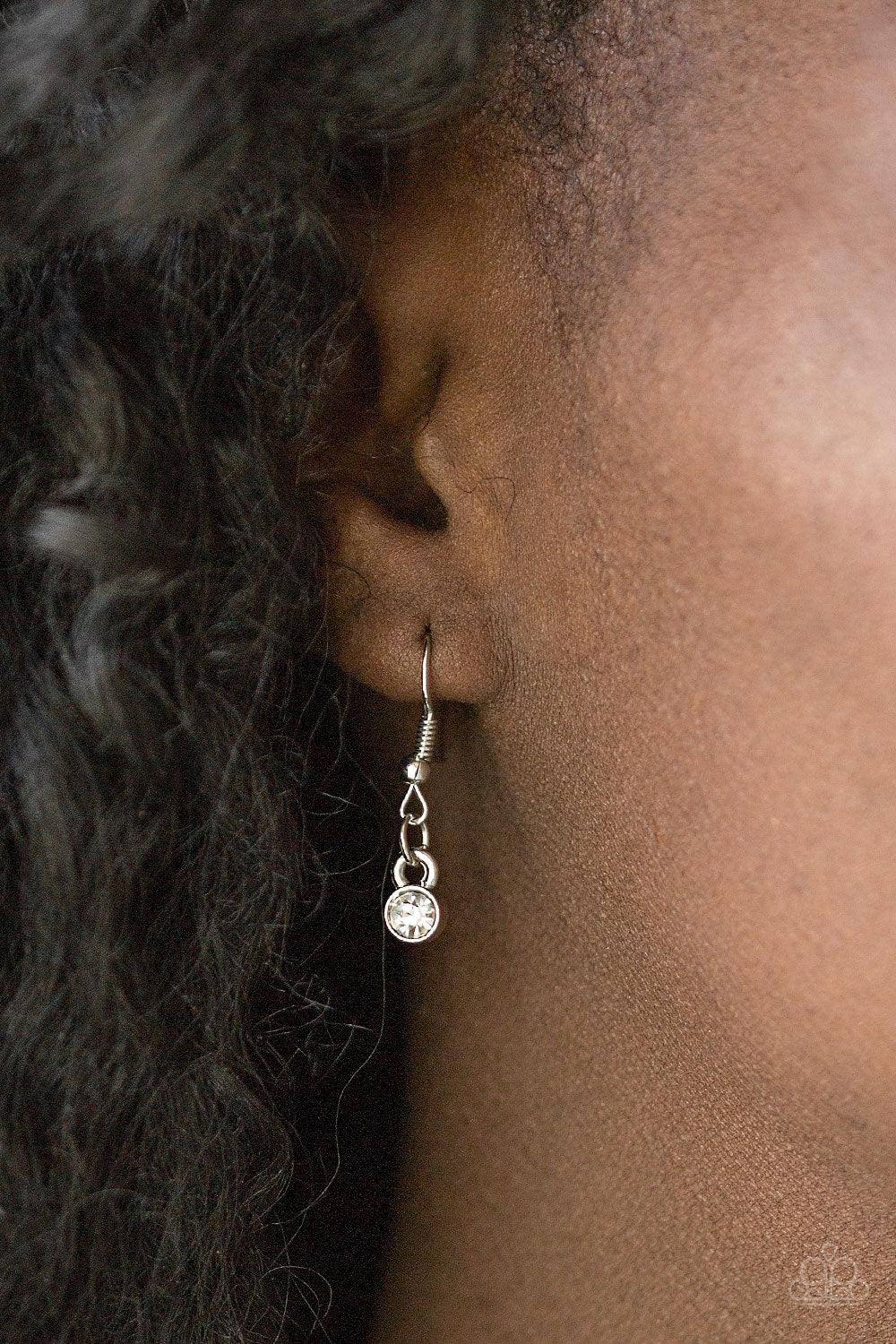 Paparazzi Accessories Leading Lady - White Gradually increasing in size near the center, glittery white marquise shaped gems link below the collar for a dramatic look. Features an adjustable clasp closure. Sold as one individual necklace. Includes one pai