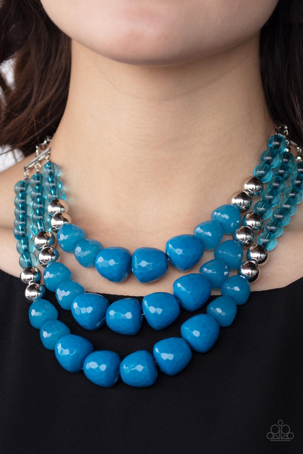 Paparazzi Accessories Forbidden Fruit - Blue Varying in shape and opacity, a collection of round and asymmetrical Mosaic Blue beads are threaded along invisible wires below the collar. Shiny silver beads sprinkled along the strands, adding hints of shimme