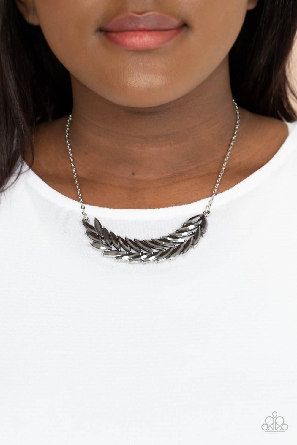 Paparazzi Accessories Flight of FANCINESS - Silver A glittery collection of marquise hematite rhinestones delicately connect into a twinkly feather, creating a sparkly stationary pendant below the collar. Features an adjustable clasp closure. Sold as one