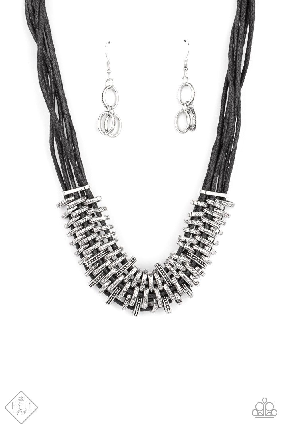 Paparazzi Accessories Lock, Stock, and SPARKLE - Black Bold and unapologetic, this hefty necklace gives off a hand-made feel with its multiple strands of black cording held together by industrial silver fittings that shift and slide. Features an adjustabl