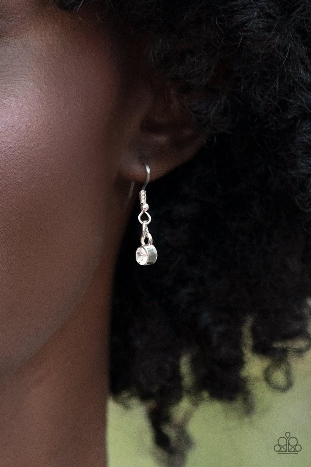 Paparazzi Accessories Limelight Luxury - White Set in silver pronged fittings, five dramatically oversized brilliant white rhinestones connect across the collar and attach to an oversized silver chain creating a stunning spot-light loving statement piece.