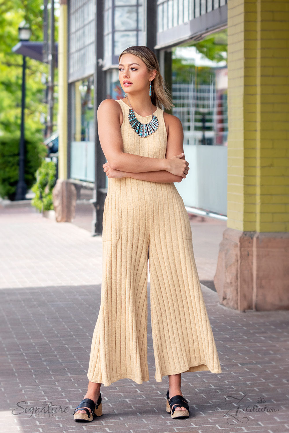 Paparazzi Accessories The Ebony Elongated silver plates featuring a high sheen finish fan out unapologetically along the collar, graduating in size as they lead down to the center. Oval-shaped turquoise stones, nestled in raised silver borders, adorn ever