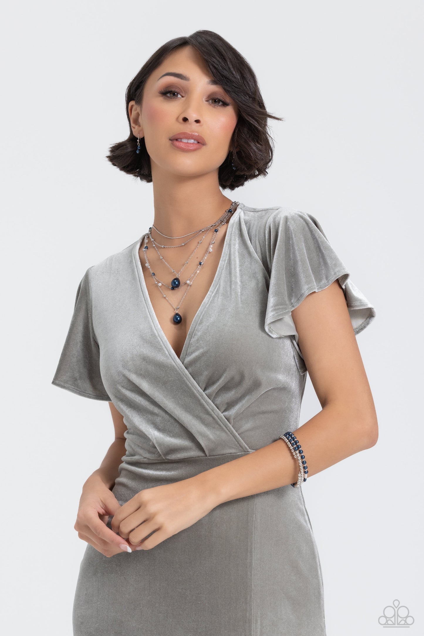 Paparazzi Accessories Just SASSING Through - Blue A collection of bright Montana pearls, white pearls, shiny silver beads and accents are threaded along a wire that coils around the wrist, creating an eye-catching infinity wrap style bracelet. Sold as one