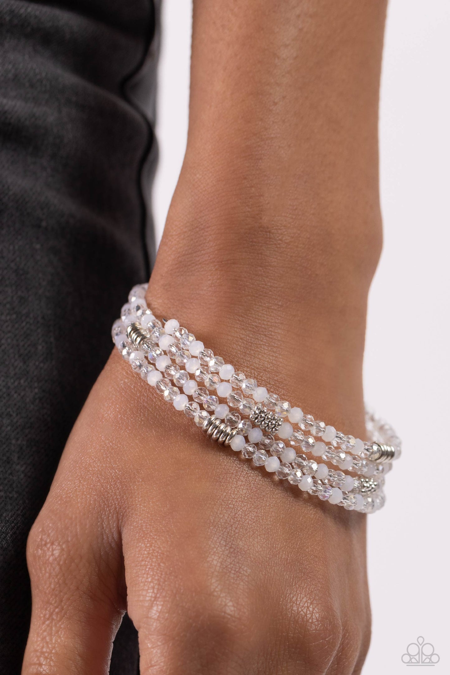Paparazzi Accessories Dreamy Debut - White Sections of clear, silver, and cloudy white beads are threaded along the wrist in an infinity wrap-style bracelet for a dreamy statement. Sold as one individual bracelet. Jewelry