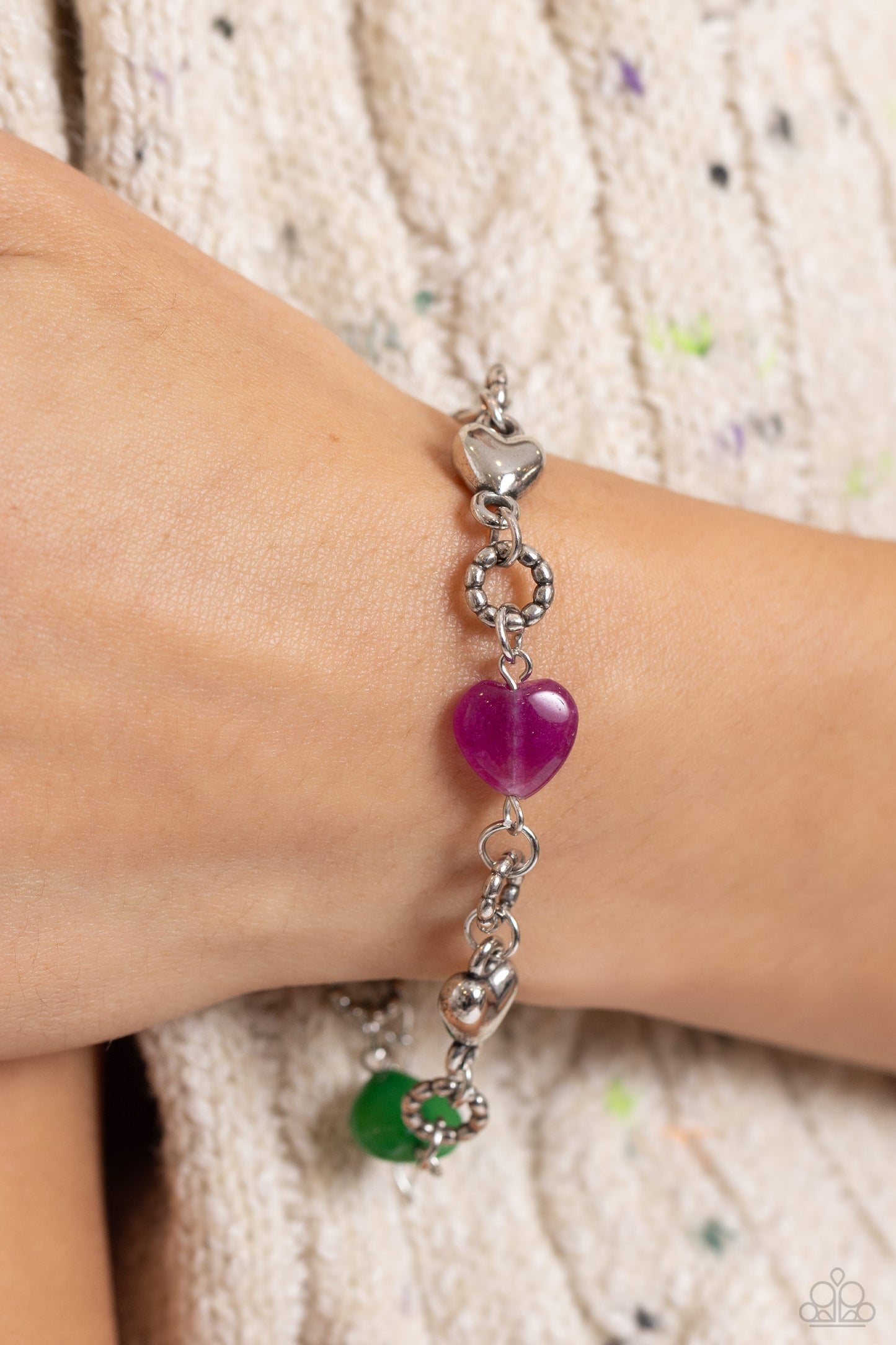 Paparazzi Accessories I Can Feel Your Heartbeat - Multi Heart-shaped lapis, jade, amethyst, and sleek silver hearts alternate along the wrist. Bubbly textured silver rings separate each heart shape infusing the romantically earthy design with a touch of h