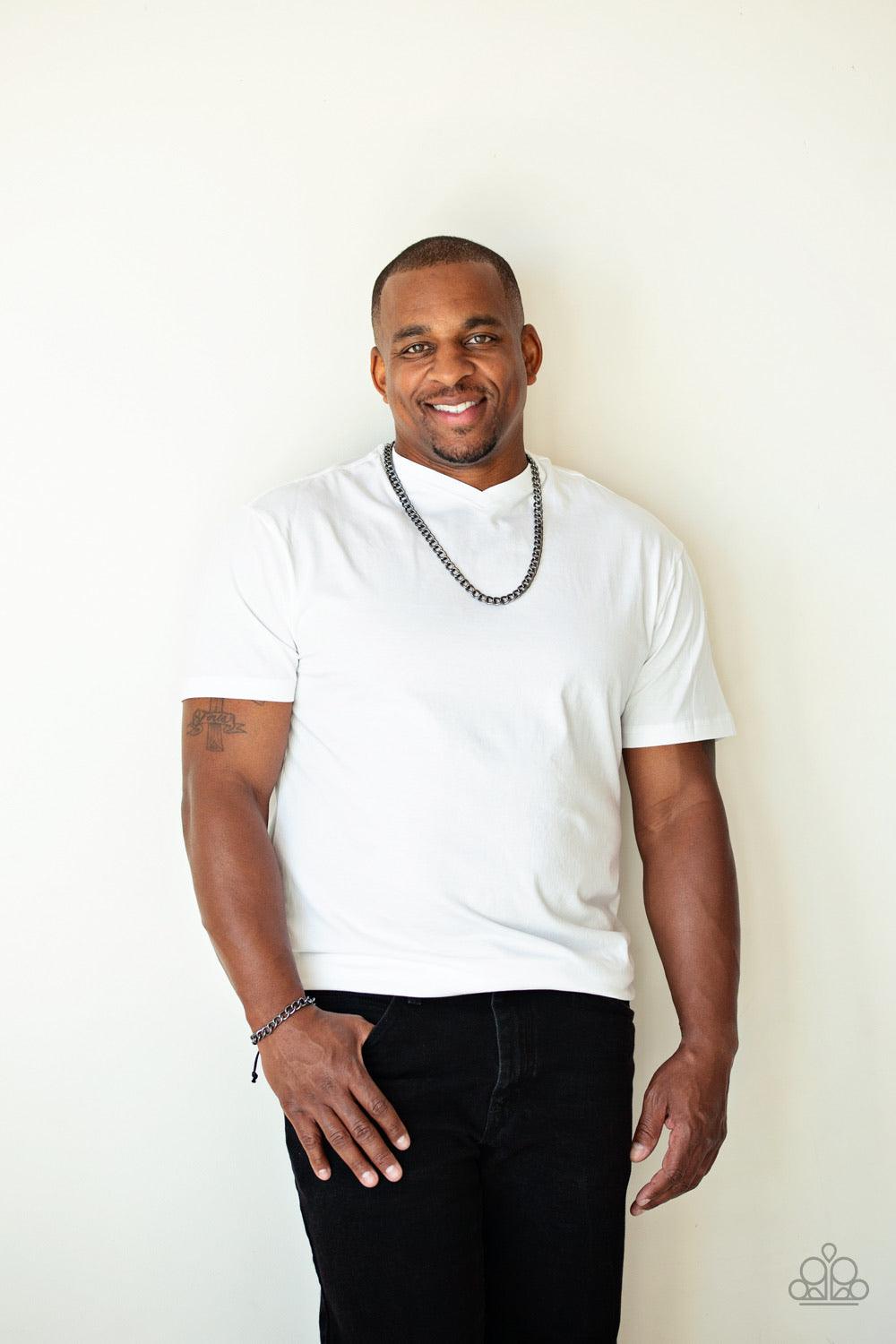 Paparazzi Accessories Sideline - Black Shiny black cording knots around the ends of a classic gunmetal cable chain that is wrapped across the top of the wrist for a versatile look. Features an adjustable sliding knot closure. Sold as one individual bracel