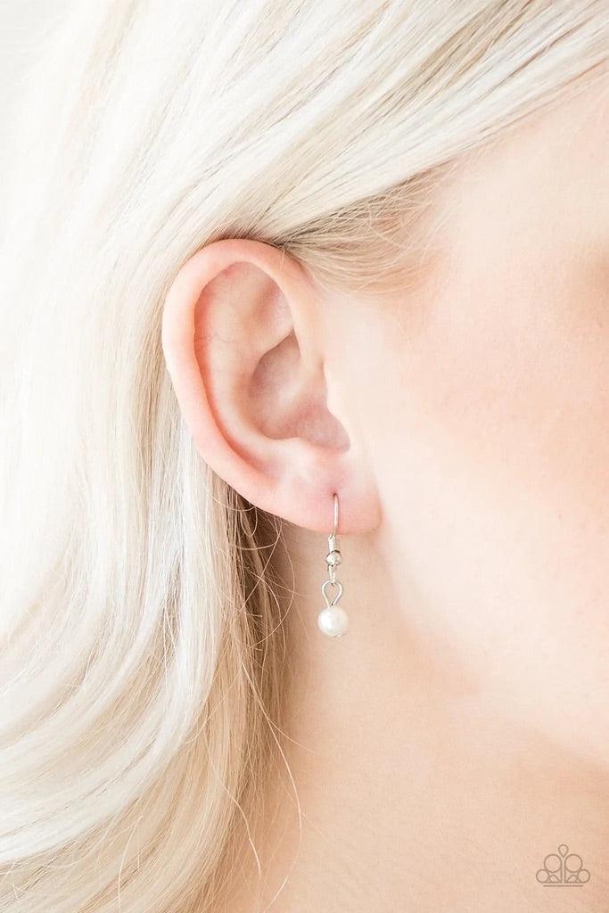 Paparazzi Accessories A Touch of Classy - White Infused with silver chain, classic white pearls are threaded along an invisible wire below the collar. Matching white pearls and glittery white rhinestones swing from the pearly strand, creating a flirtatiou