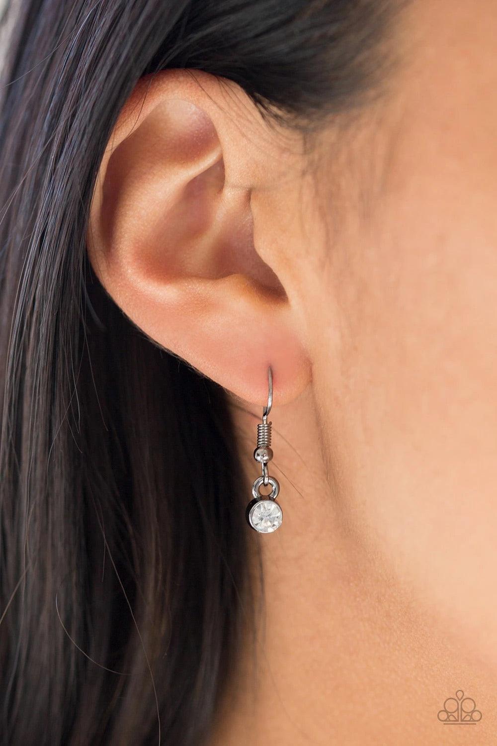 Paparazzi Accessories Make The World Sparkle - Black *Lanyard A white rhinestone encrusted teardrop gives way to a smooth gunmetal teardrop, creating refined layers down the chest. A lobster clasp hangs from the bottom of the design to allow a name badge