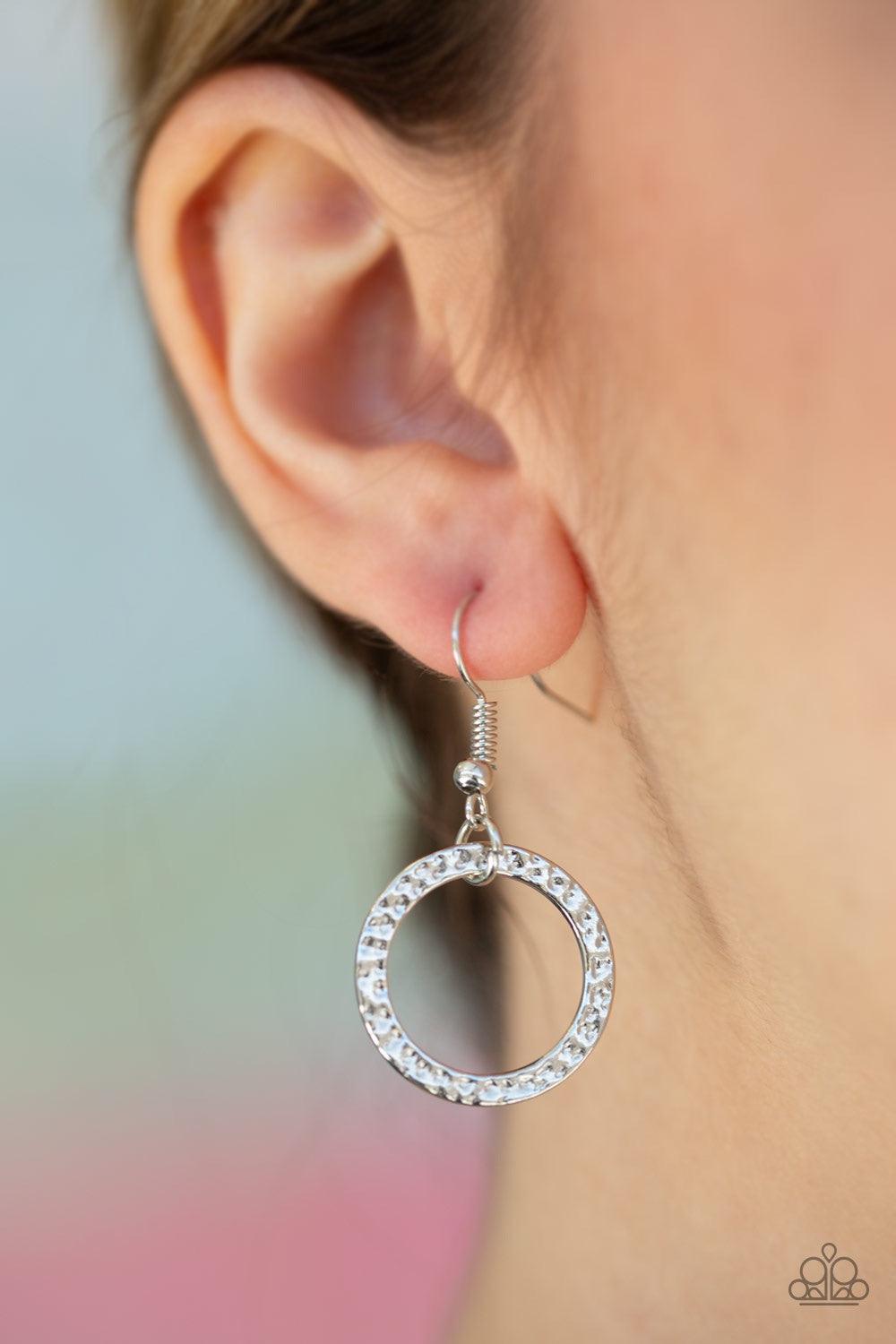 Paparazzi Accessories Coast Coasting - Silver Brushed in an iridescent finish, shell-like hoops join mismatched silver hoops at the bottom of an elongated silver chain for a whimsical look. A lobster clasp hangs from the bottom of the design to allow a na