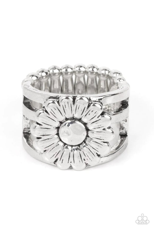 Paparazzi Accessories Roadside Daisies - Silver Brushed in an antiqued shimmer, a rustic silver daisy blooms atop layered silver bands for a whimsical fashion. Features a stretchy band for a flexible fit. Jewelry