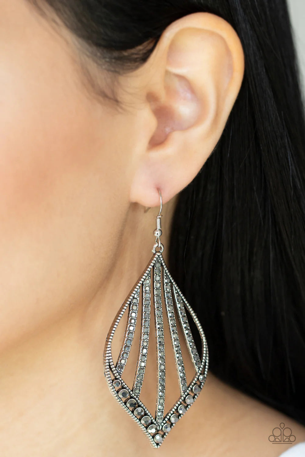 Paparazzi Accessories Showcase Sparkle - Silver Curved rows of smoky hematite rhinestones streak across the center of a studded marquise shaped silver frame. The bottom of the frame is encrusted in matching hematite rhinestones, creating a dramatic center