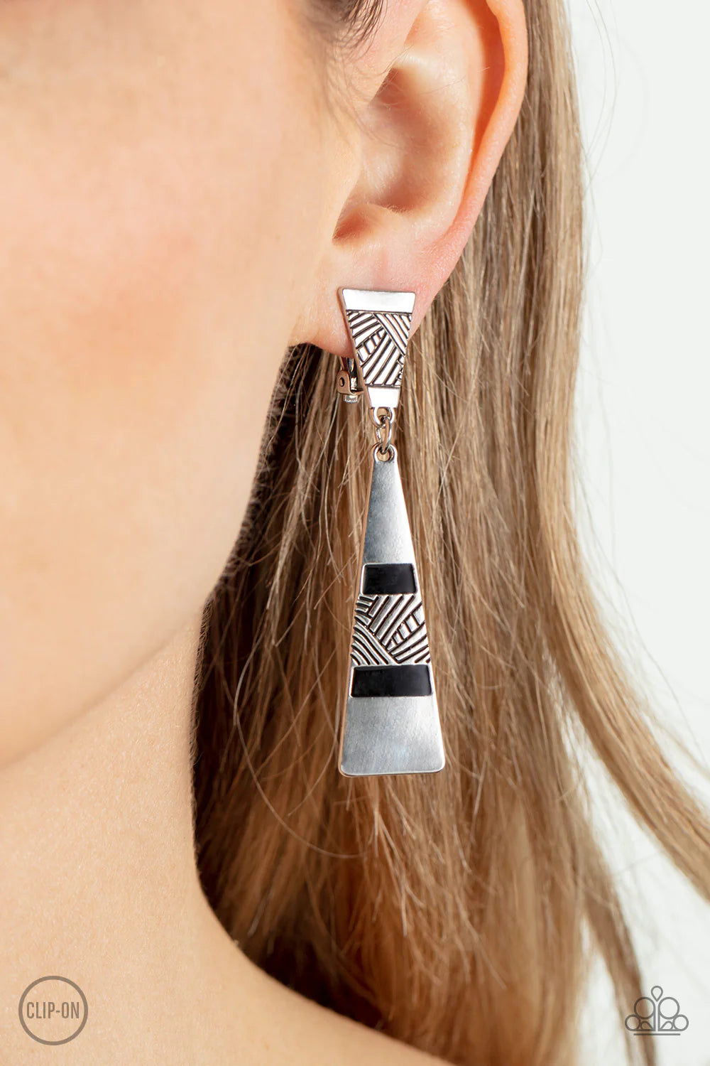 Paparazzi Accessories Safari Seeker - Black Etched in sections of slanted textile-like patterns, two antiqued triangular silver frames link into an edgy lure. The lowermost frame is painted in rows of shiny black accents, adding a neutral pop of color to
