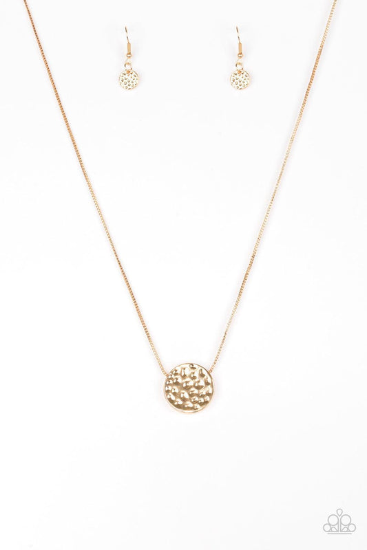 Paparazzi Accessories The BOLD Standard - Gold Delicately hammered in shimmery detail, a glistening gold pendant slides along a dainty gold box-chain below the collar for a bold look. Features an adjustable clasp closure. Sold as one individual necklace.