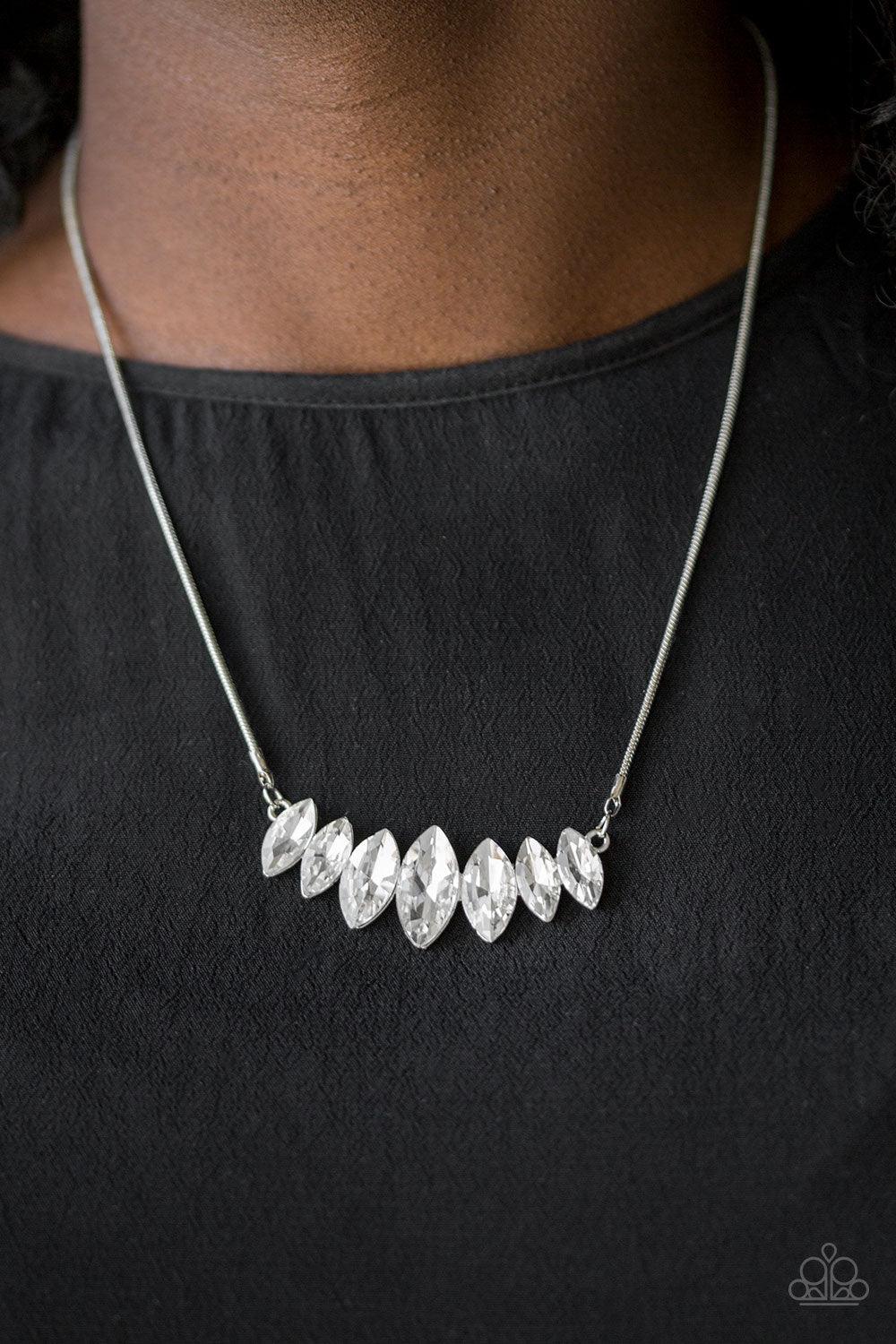 Paparazzi Accessories Leading Lady - White Gradually increasing in size near the center, glittery white marquise shaped gems link below the collar for a dramatic look. Features an adjustable clasp closure. Sold as one individual necklace. Includes one pai