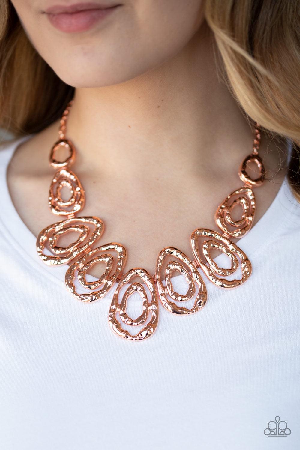 Paparazzi Accessories Terra Couture - Copper Delicately hammered in blinding shimmer, shiny copper bars spin into asymmetrical teardrops. The airy abstract frames link into a bold industrial statement piece below the collar. Features an adjustable clasp c