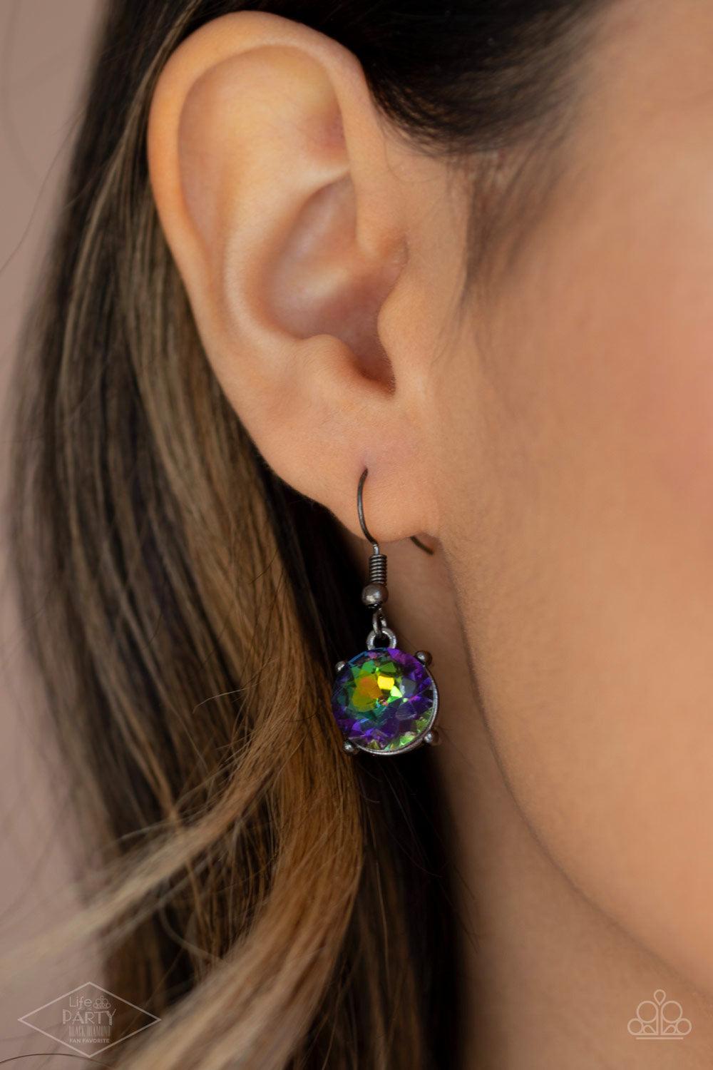 Paparazzi Accessories Iridescent Icing - Multi Featuring oil spill centers and sleek gunmetal fittings, a collection of oversized rhinestones link below the collar for an icy look. Features an adjustable clasp closure. Sold as one individual necklace. Inc