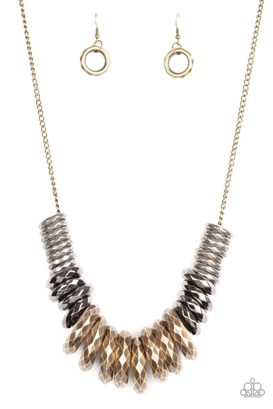 Paparazzi Accessories Haute Hardware - Multi Gradually increasing in size, a collision of faceted tin finished silver, gunmetal, and brass rings slide along a classic brass chain below the collar for a bold industrial look. Features an adjustable clasp cl
