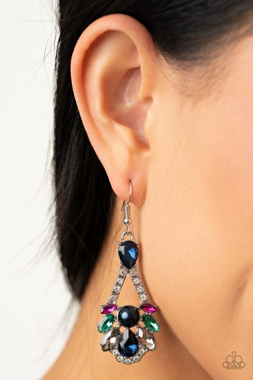 Paparazzi Accessories Prismatic Presence - Mutli A sparkly series of marquise and teardrop blue, pink, green, and smoky rhinestones embellish the front of a white rhinestone encrusted silver frame. A dainty white pearl adorns the center, adding a splash o