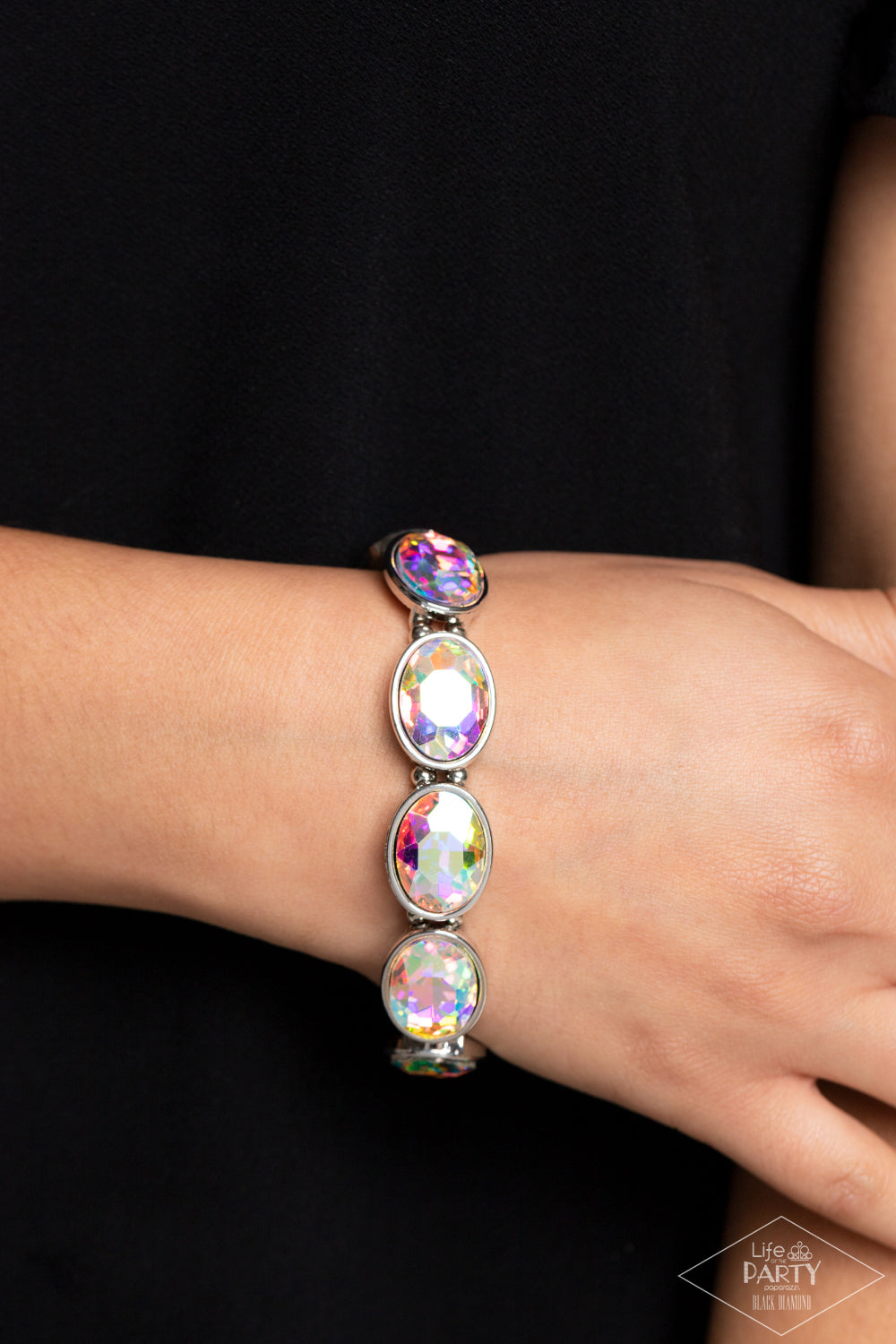 Paparazzi Accessories Diva In Disguise - Multi Glittery iridescent gems are pressed into sleek silver frames. Infused with dainty silver beads, the sparkly frames are threaded along stretchy bands for a glamorous look around the wrist. Due to its prismati