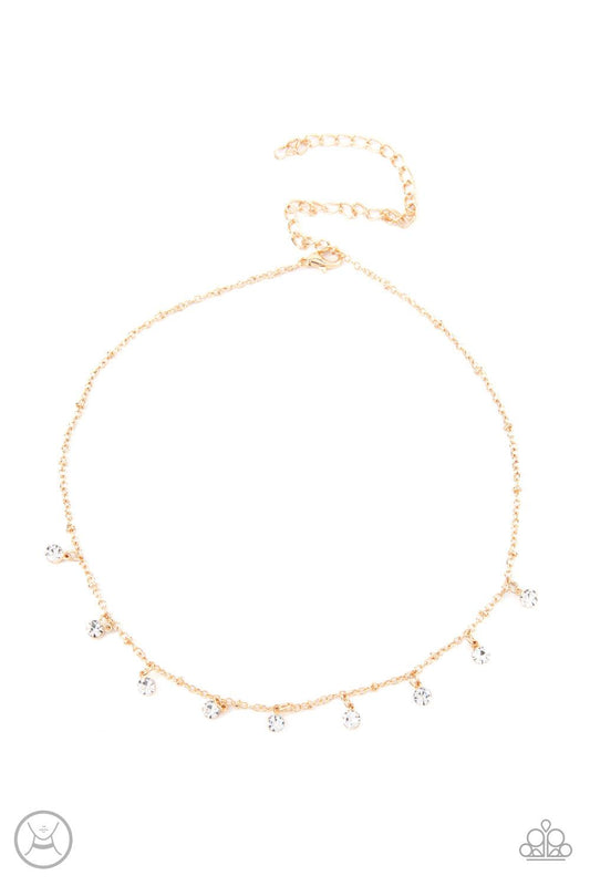 Paparazzi Accessories Dainty Diva - Gold Glassy white rhinestones swing from a dainty gold chain, creating a glamorous fringe around the neck. Features an adjustable clasp closure. Sold as one individual choker necklace. Includes one pair of matching earr