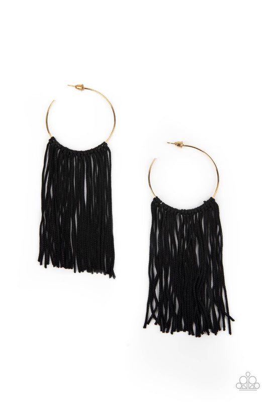 Paparazzi Accessories Flauntable Fringe - Gold A curtain of black cords stream from the center of a dainty gold hoop, creating a glamorous fringe. Earring attaches to a standard post fitting. Hoop measures approximately 1 3/4" in diameter. Sold as one pai