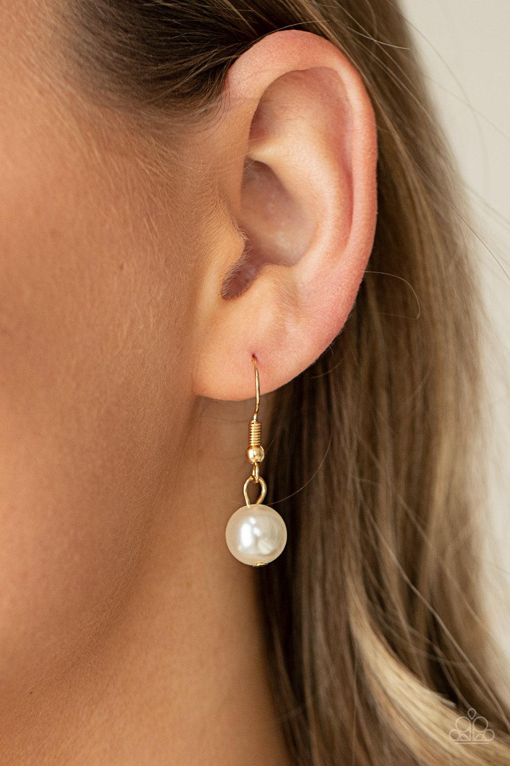 Paparazzi Accessories Ensconced in Elegance - Gold Textured gold rings and oversized white pearls delicately link into a bubbly statement piece below the collar. Features an adjustable clasp closure. Sold as one individual necklace. Includes one pair of m