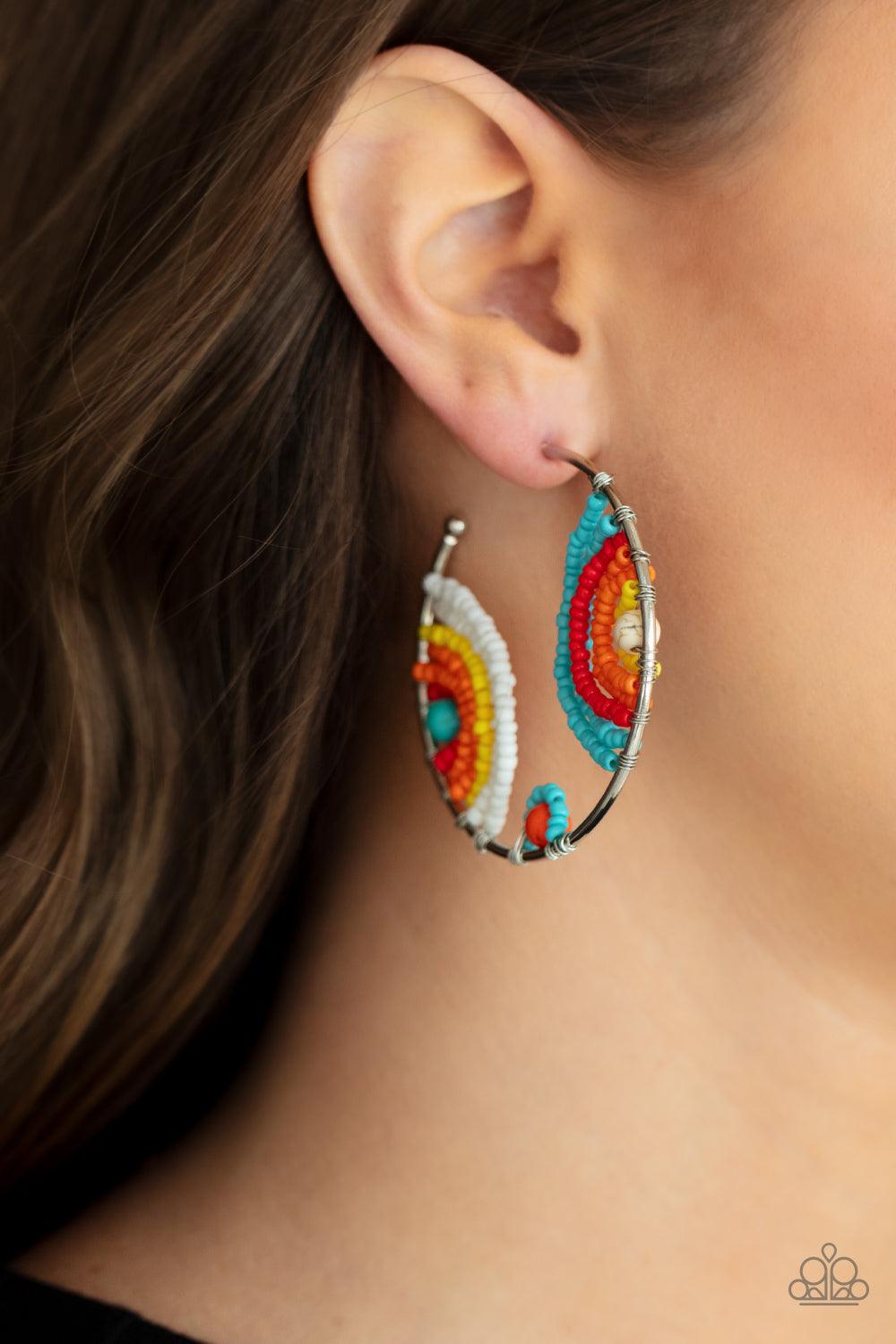 Paparazzi Accessories Rainbow Horizons - Multi Rows of turquoise, red, orange, yellow, and white seed beads curl around turquoise, orange, and white stone centers, creating colorful rainbows inside a delicate wire wrapped hoop. Hoop measures approximately