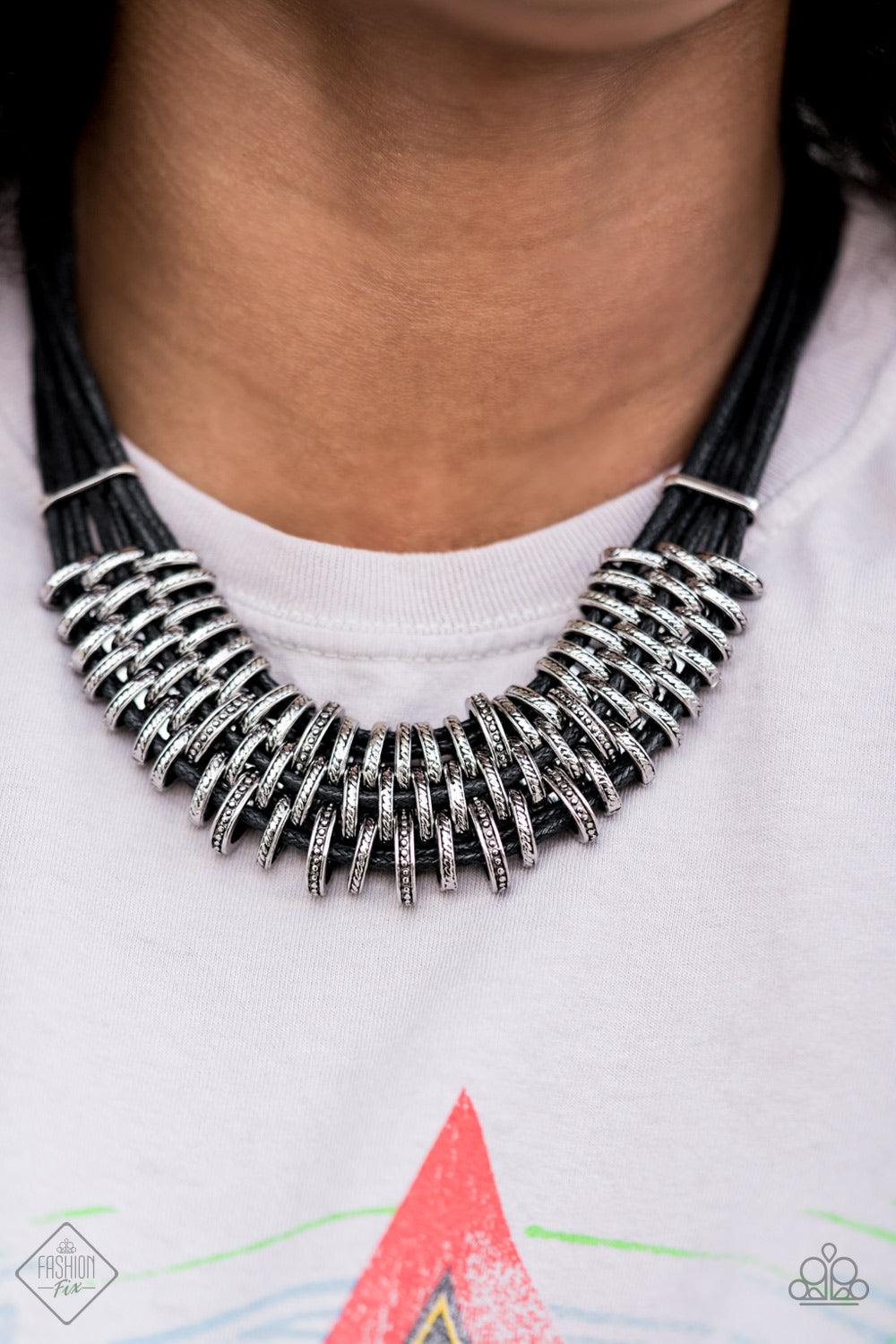 Paparazzi Accessories Lock, Stock, and SPARKLE - Black Bold and unapologetic, this hefty necklace gives off a hand-made feel with its multiple strands of black cording held together by industrial silver fittings that shift and slide. Features an adjustabl