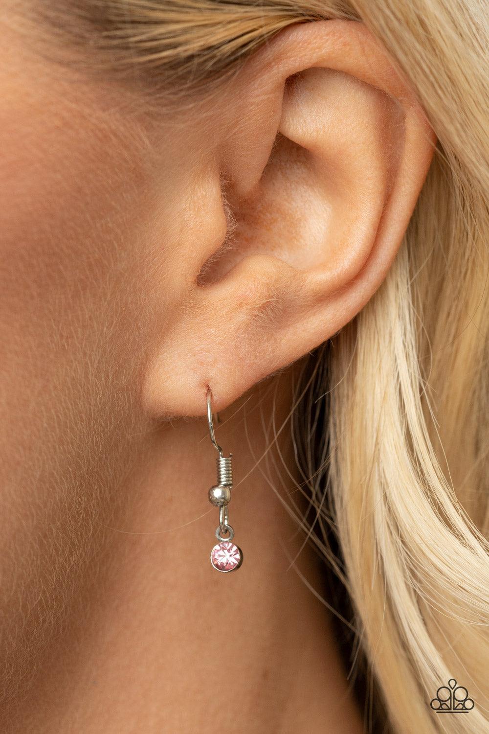 Paparazzi Accessories Maternal Blessings - Pink A silver disc inscribed with the phrase, "To the world you are a Mother, but to your family you are the World," creates a sweet reminder as it falls from a lengthened silver chain. A sprinkle of dainty light