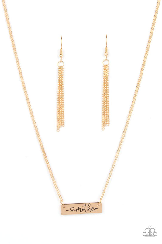 Paparazzi Accessories Joy Of Motherhood - Gold Stamped in a heart and the word, "Mother," a glistening gold plate is suspended by a classic gold chain below the collar, creating a whimsy sentimental pendant. Features an adjustable clasp closure. Sold as o