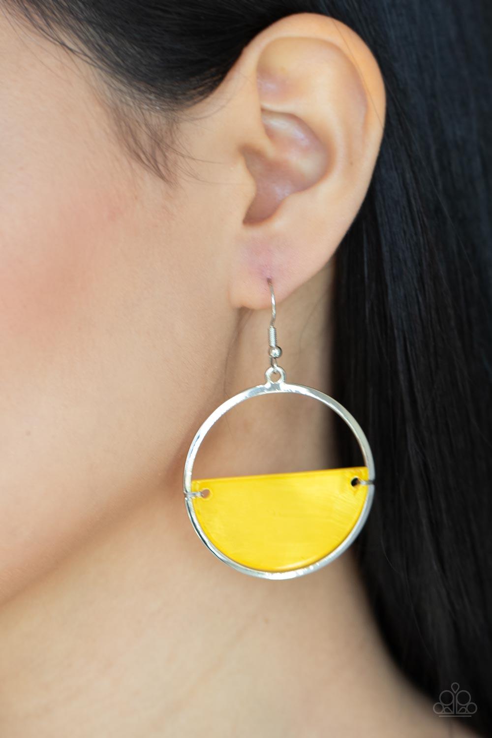 Paparazzi Accessories Seashore Vibes - Yellow Brushed in an iridescent shimmer, an Illuminating half moon shell attaches to the bottom of a flat silver hoop for a summery splash of color. Earring attaches to a standard fishhook fitting. Sold as one pair o