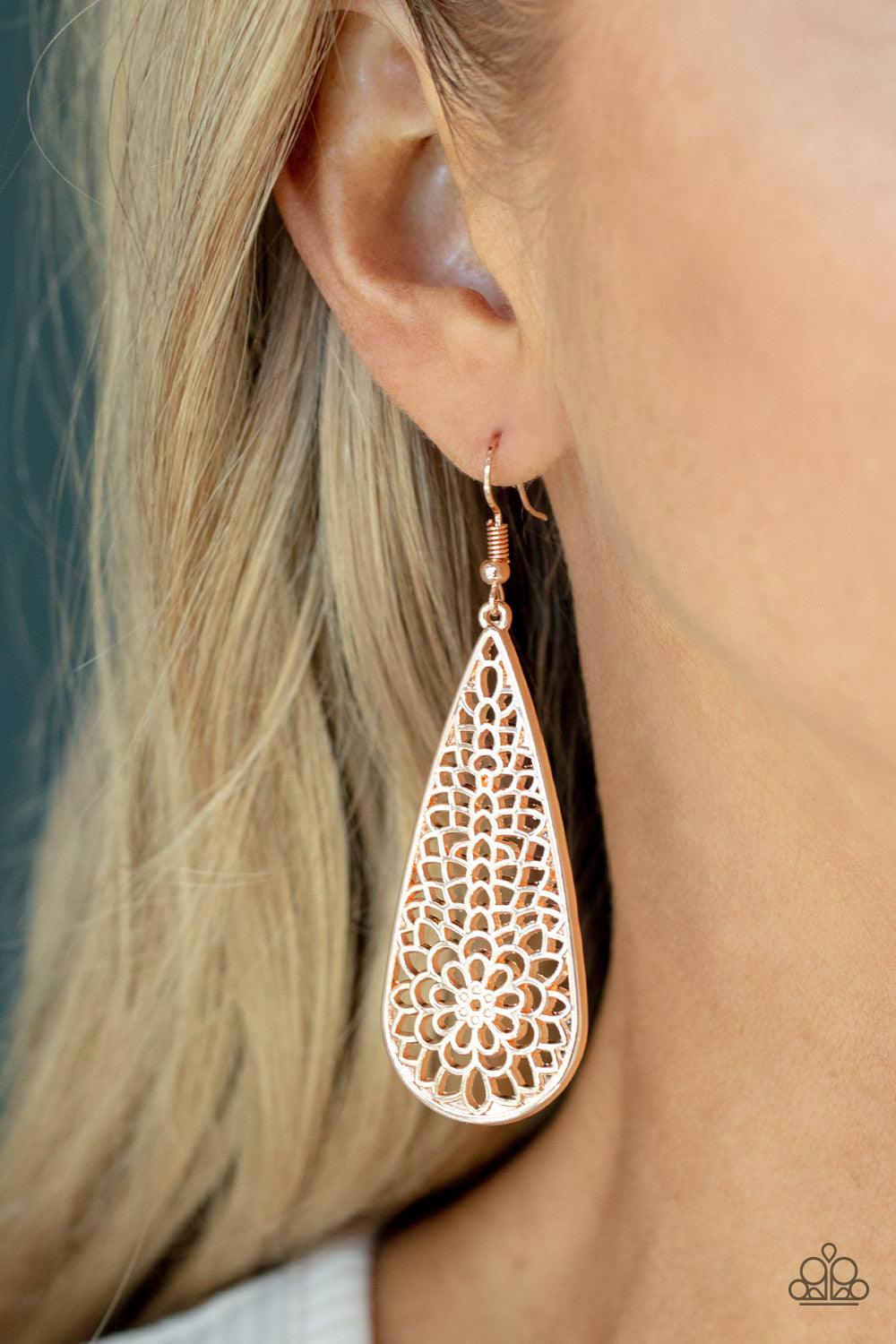 Paparazzi Accessories Posy Pasture - Rose Gold A mesmerizing explosion of shiny rose gold filigree petals bursts inside an oversized teardrop frame creating a dreamy nature inspired lure. Earring attaches to a standard fishhook fitting. Sold as one pair o