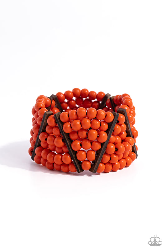 Paparazzi Accessories Way Off TROPIC - Orange Stacked layers of vibrant orange wooden beads are threaded along stretchy bands making a bold statement. Slender wooden bars are woven in on an angle and lean in opposite directions as they work their way arou