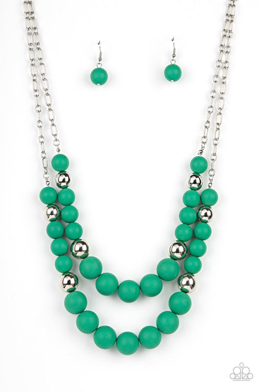 Paparazzi Accessories Vivid Vanity - Green Gradually increasing in size, two oversized rows of silver and Leprechaun beads layer into two bubbly layers below the collar. Features an adjustable clasp closure. Sold as one individual necklace. Includes one p