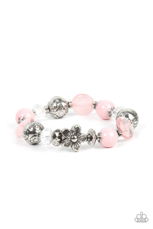 Paparazzi Accessories Pretty Persuasion - Pink An enchanting assortment of silver floral beads and studded silver rings join an opaque, glassy, and iridescent assortment of pink and white beads along a stretchy band around the wrist for a whimsical pop of