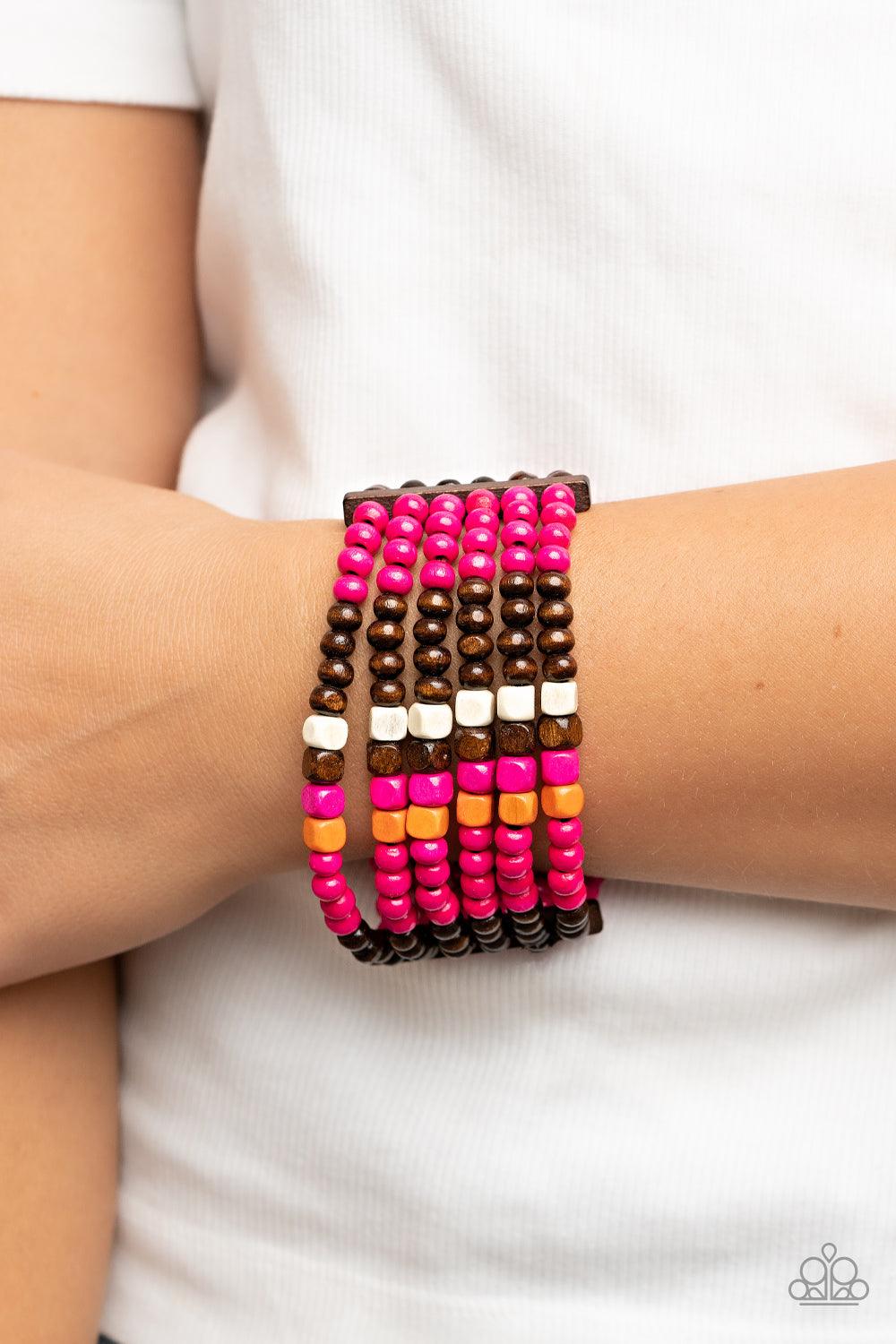 Paparazzi Accessories Dive into Maldives - Pink Held together with rectangular wooden frames, a colorful collection of orange, brown, white, and Fuchsia Fedora cube and round wooden beads are threaded along stretchy bands around the wrist for a splash of