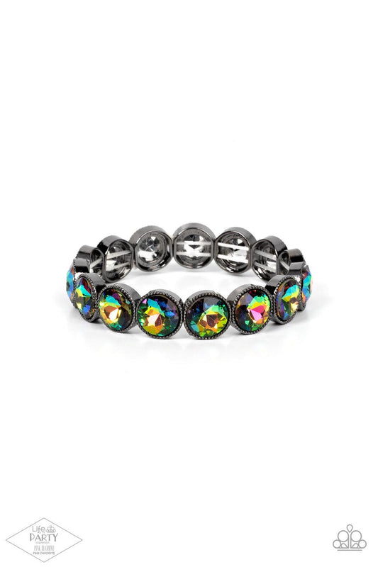 Paparazzi Accessories Number One Knockout - Multi Faceted oil spill gems are pressed into sleek gunmetal frames. The glittery frames are threaded along stretchy bands, creating a glamorous look around the wrist. Sold as one individual bracelet. Jewelry