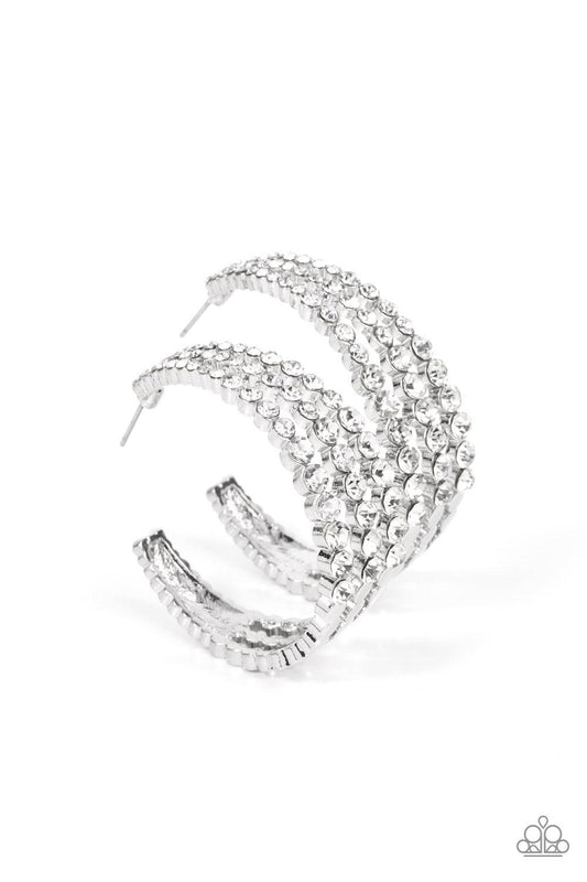 Paparazzi Accessories Cosmopolitan Cool - White Cascading layers of sparkling white rhinestones plunge into flattened silver plates creating a stunning eye-catching hoop earring. Earring attaches to a standard post fitting. Hoop measures approximately 2"