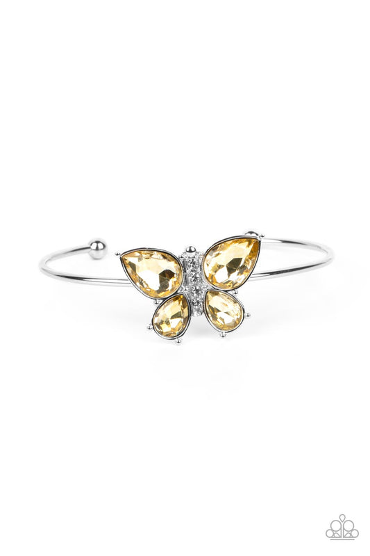 Paparazzi Accessories Butterfly Beatitude - Yellow A silver butterfly with yellow teardrop rhinestone wings and a white-rhinestone body delicately perches atop a shiny silver cuff. Sold as one individual bracelet. Get The Complete Look! Necklace: "Free-Fl