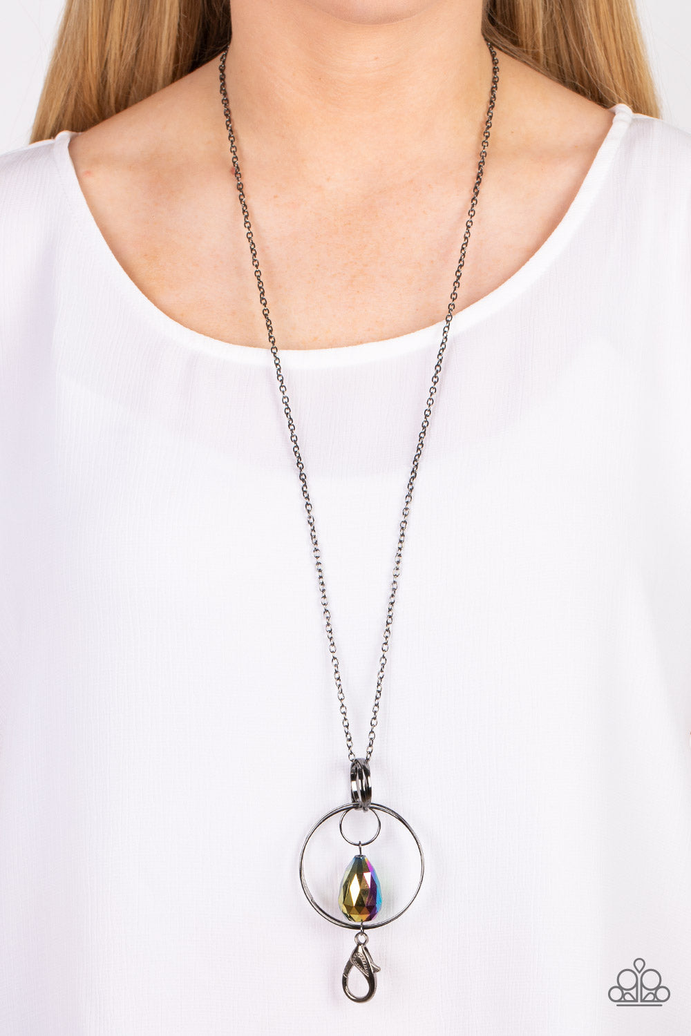 Paparazzi Accessories Swinging Shimmer - Multi *Lanyard Featuring an oversized faceted teardrop coated in a reflective oil spill finish, the teardrop swings from a mismatched collection of interconnected gunmetal rings at the bottom of an extended gunmeta
