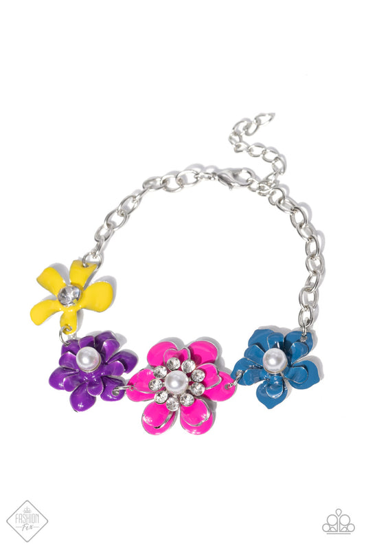 Paparazzi Accessories Flower Patch Fantasy - Multi A collection of colorful flowers link around the wrist to create a vibrant statement piece. A mix of shimmery pearls and sparkling white rhinestones decorate the center of each flower, infusing the piece