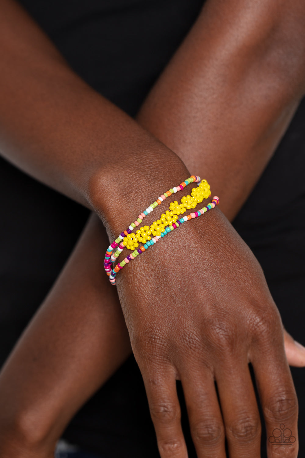 Paparazzi Accessories Buzzworthy Botanicals - Multi Strung along the entirety of three elastic stretchy bands, multicolored seed beads, in shades of pink, purple, blue, orange, white, and green coalesce around the wrist. Featured on one of the multicolore