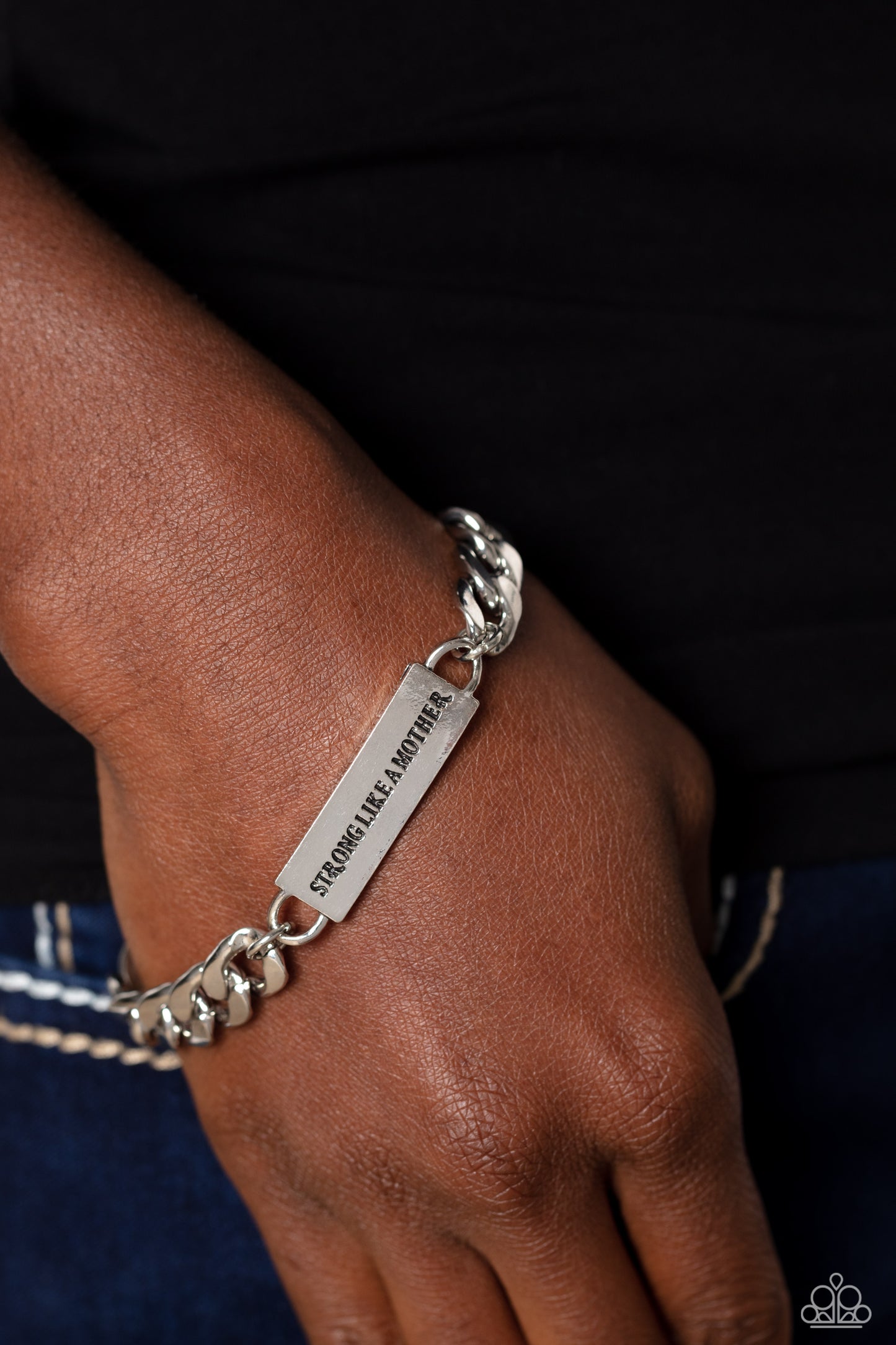 Paparazzi Accessories Mighty Matriarch - Silver Attached to a thick, silver curb chain, a rectangular plate is stamped with the phrase "strong like a mother," for a sentimental, urban statement around the wrist. Features an adjustable clasp closure. Sold