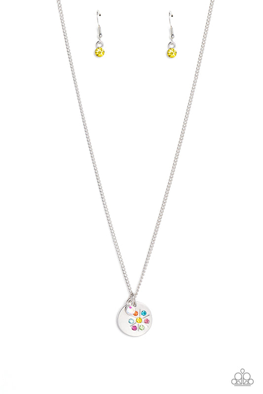 Paparazzi Accessories Dandelion Delight - Multi Falling from a dainty silver chain, a silver disc is embossed with colorful rhinestones that encircle around a dandelion stamped shape. Gliding next to the silver disc, a solitaire iridescent rhinestone set