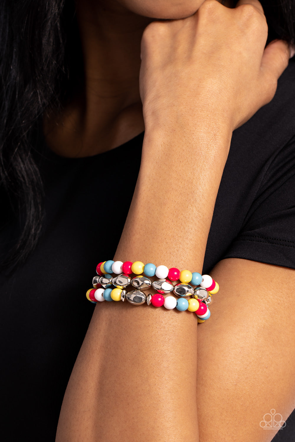 Paparazzi Accessories The Candy Man Can - Multi Vibrant Pink Peacock, white, blue, and Primrose beads mix with warped, silver rhombus beads to create a colorfully geometric statement around the wrist. Strung on elastic stretchy bands around the wrist, sil