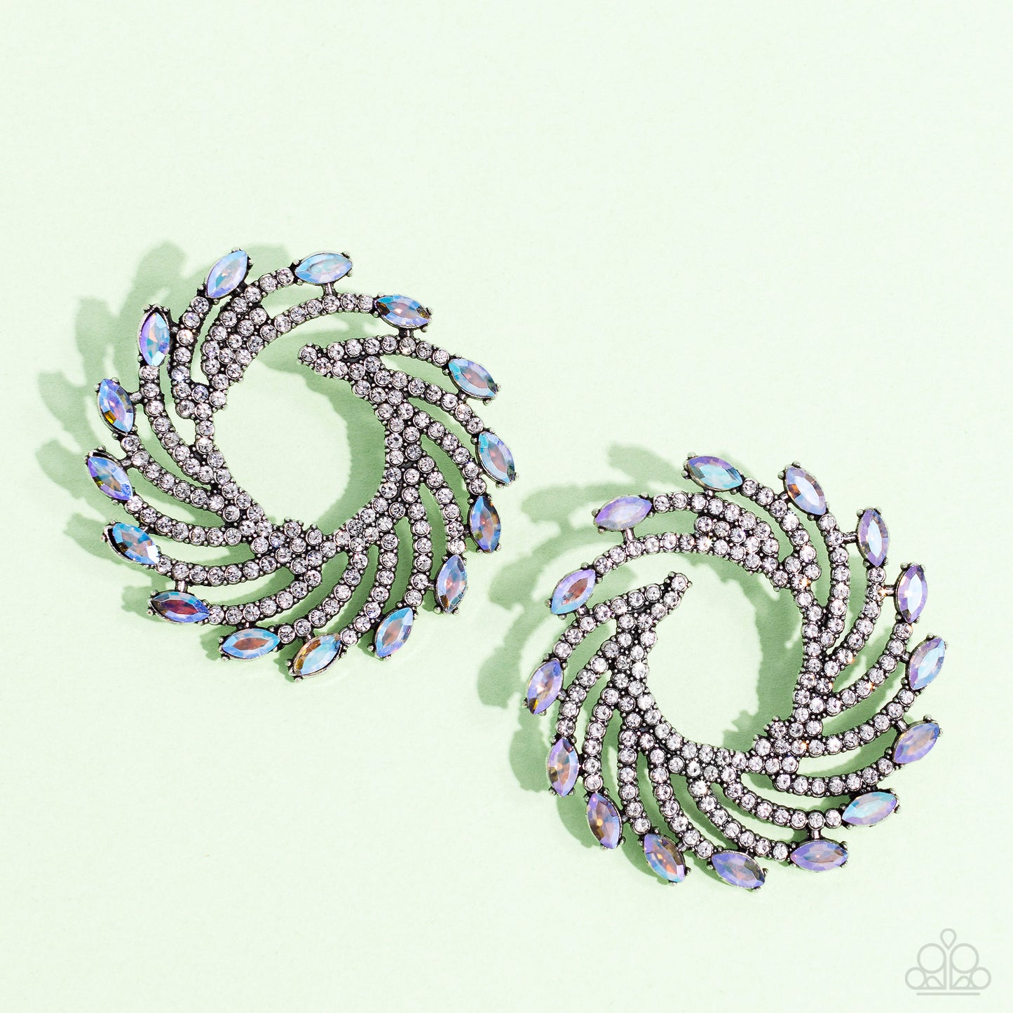 Paparazzi Accessories Firework Fanfare - Multi Shimmery strands of silver spin out from an airy center, creating an exaggerated firework-like display at the ear. An explosion of dainty white rhinestones lines the swirls and curves of the shimmery display