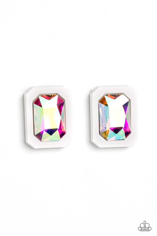 Paparazzi Accessories Edgy Emeralds - Multi 2 Standing out against a white rubber backdrop, an oversized, faceted emerald-cut iridescent gem shimmers and shines for an edgy sparkle against the ear. Earring attaches to a standard post fitting. Due to its p